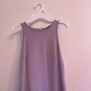 Small, shimmery, purple sleeveless dress with slit